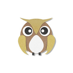 Owl perched paper craft on paper background.
