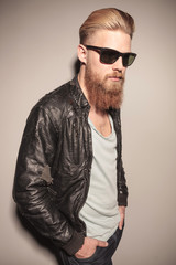 Fototapeta premium Fashion young man posing on studio background