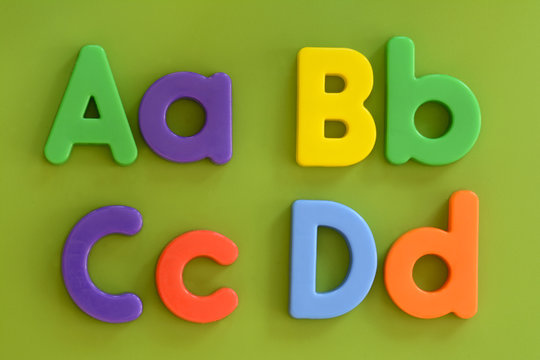 Close up of Aa, Bb, Cc, Dd, in colorful plastic letters