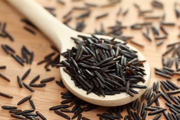 Wild rice in a wooden spoon