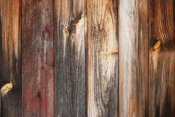 Old rustic weathered barn wood background with knots