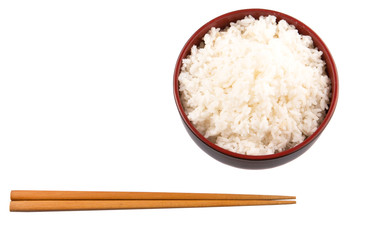 A bowl of rice and a pair of chopstick over white background