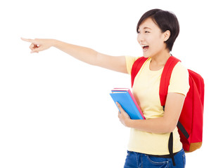 happy student girl holding book and pointing