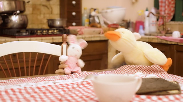 Stuffed toys bunny duck in kitchen