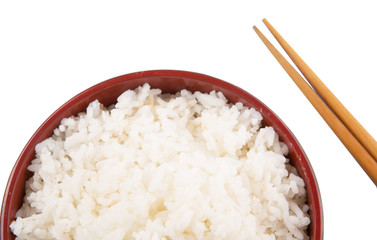 A bowl of rice and a pair of chopstick over white background