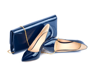 Beautiful blue shoes with clutches on white isolated background