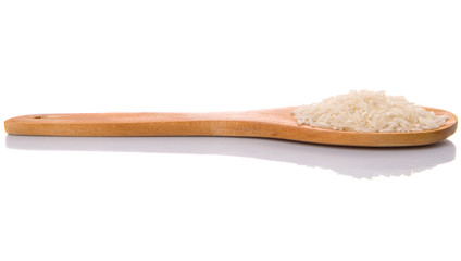 Raw and uncooked rice in wooden spoon over white background