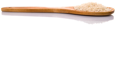 Raw and uncooked rice in wooden spoon over white background