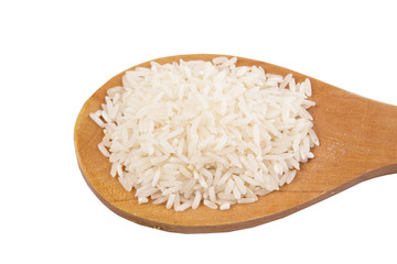 Raw and uncooked rice in wooden spoon over white background
