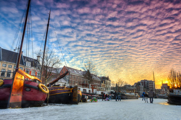 Skating on a canal in a city