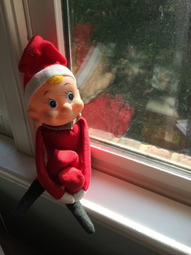 Retro Elf Doll On Window Ledge