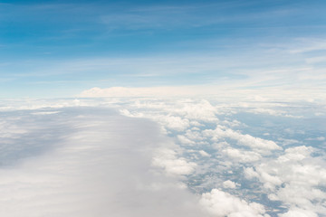 Fototapeta na wymiar Airplane trace over the clouds