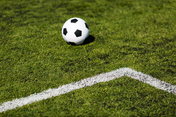 Green pitch with soccer ball