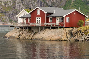 Fototapeta na wymiar Typical norwegian fishing village with traditional huts