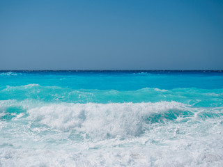 wild beach with rocks in water. Island Lefkada, Greece
