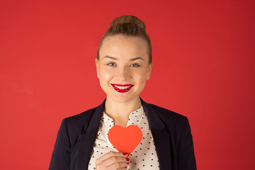 business woman holding a heart