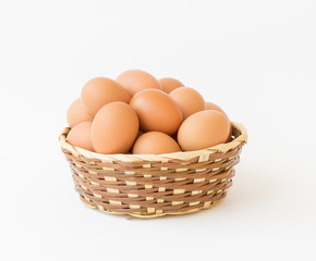 egg in basket wicker on white background