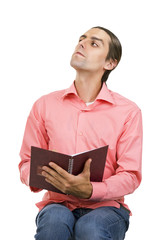 A Serious Emotional Young Man with a notepad (notebook)