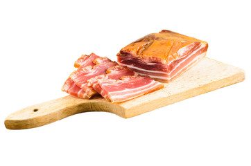 Raw smoked bacon on a wooden plate