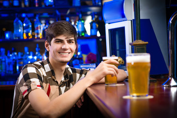 portrait of a young man at the bar