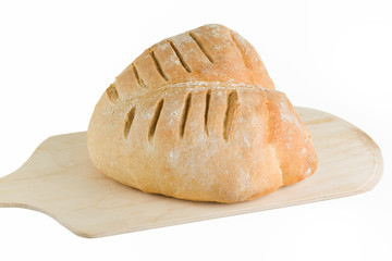 Freshly baked bread on bakers peel