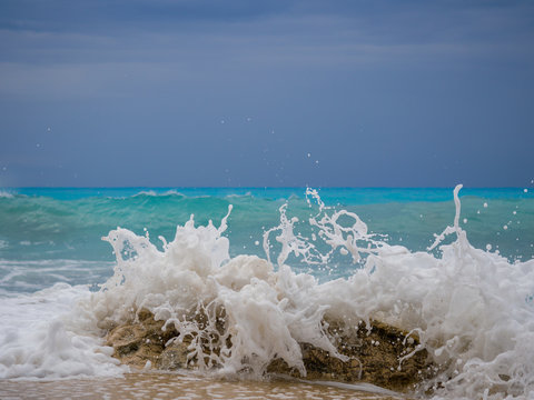 waves breaking on a stony beach