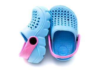 Blue baby shoes isolated on white background