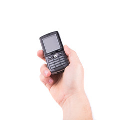 Hand holds black cell phone.