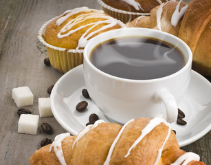 cup of hot coffee and a muffin
