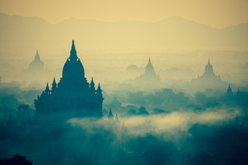 Sunrise over temples of Bagan in Myanmar with cross-processed co