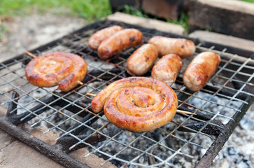 Delicious german sausages on the barbecue grill