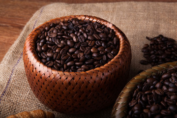 roasted coffee beans in a bamboo basket