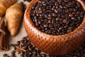 roasted coffee beans in a bamboo basket