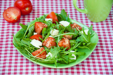 fresh salad with mozzarella, ruccola and tomatoes