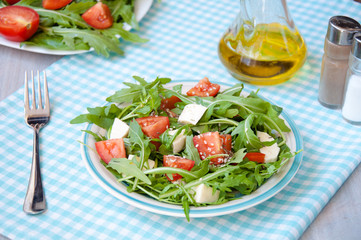 fresh salad with mozzarella, ruccola and tomatoes