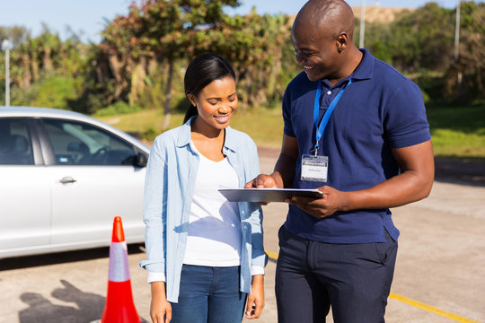 african learner driver with instructor
