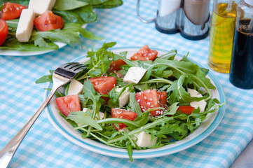 fresh salad with mozzarella, ruccola and tomatoes