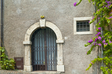Fototapeta na wymiar Old door at Limone, Garda lake, Italy