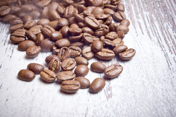 Coffee seeds on wooden surface texture. 
