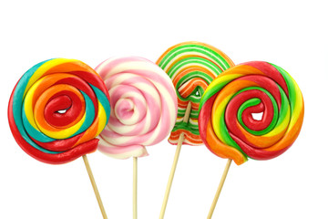 Colorful spiral lollipops on white background