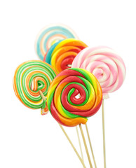 Fototapeta na wymiar Colorful spiral lollipops on white background