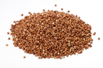 Pile of buckwheat on white background