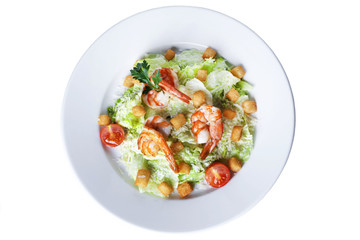 Caesar salad with shrimp on a plate