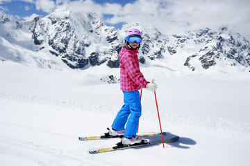 Fototapeta na wymiar Ski, winter fun - lovely skier girl enjoying ski vacation
