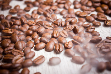 Coffee seeds on wooden surface texture. 