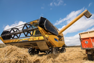 combine harvester and tractor