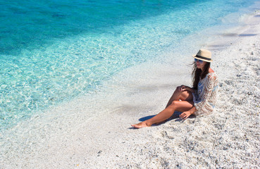 Young beautiful girl during italian vacation on white beach