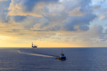 Offshore jack up drilling rig and supply boat