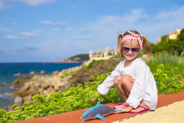 Portrait of adorable little girl outdoors during summer vacation