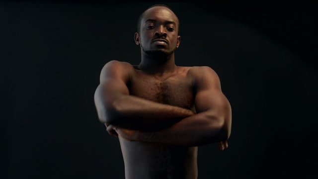 African-american man praying on black background